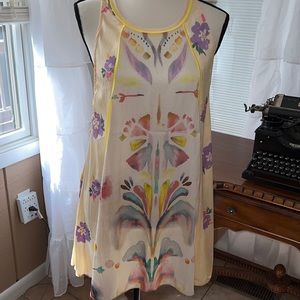 NWOT Free People Dream Free Yellow silk tunic with side straps and keyhole back